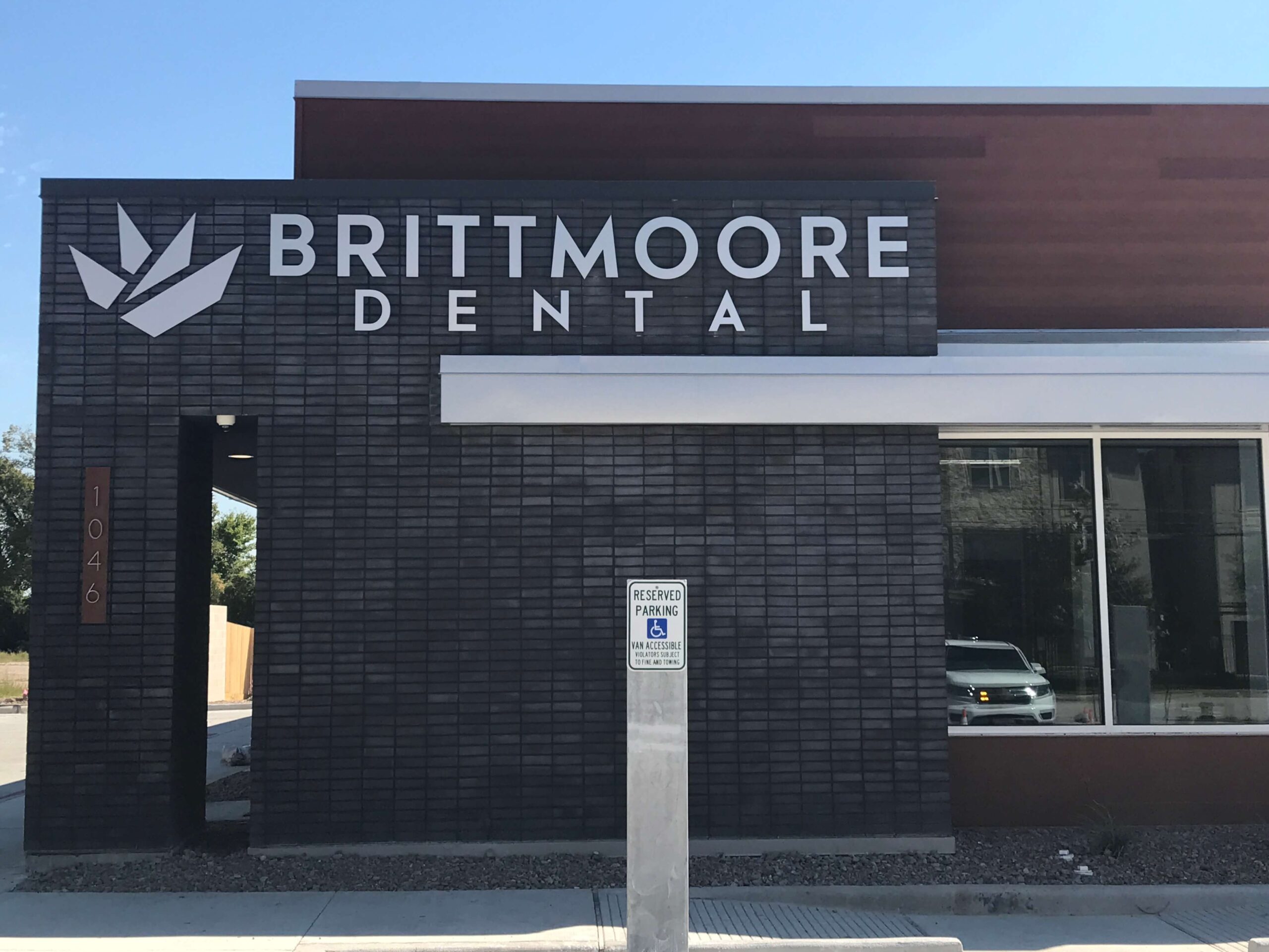 Exterior of Brittmoore Dental with sleek, modern signage, showing how professional signs help businesses stand out and attract attention.